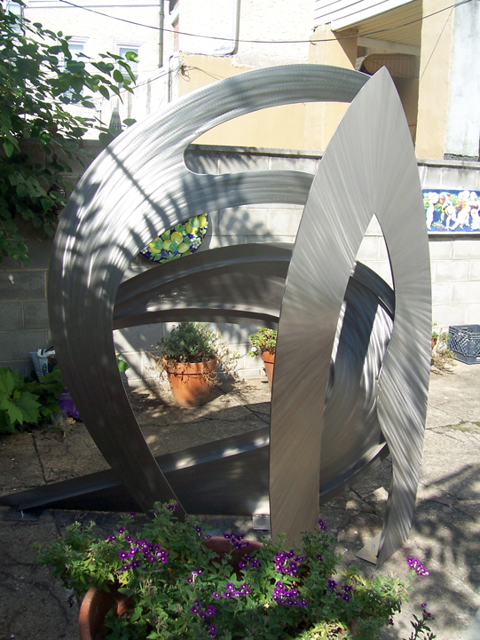 abstract, contemporary, free standing, stainless steel sculpture